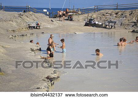 Bathers enjoying volcanic mud, hot springs, Vulcano Island, Aeolian Islands, Italy, Europe View Large Photo Image Stock Photo - Bathers enjoying volcanic mud, hot springs, Vulcano Island, Aeolian Islands, Italy, Europe. Fotosearch