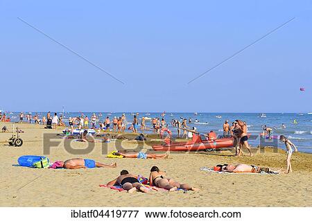Bathers on a sandy beach, Bibione, Adriatic Sea, Veneto, Italy, Europe View Large Photo Image Stock Photo - Bathers on a sandy beach, Bibione, Adriatic Sea, Veneto, Italy, Europe. Fotosearch