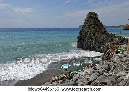 Stock Photograph - Beach with sunshades in Marina di Camerota, Cilento National Park, Province of Salerno, Campania, Italy, Europe. Fotosearch