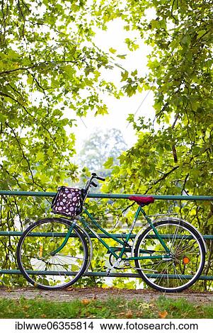 Picture - Bicycle leaning on the railing, Piestany, Slovakia, Europe. Fotosearch