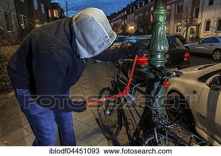 Bicycle theft, thief with bolt cutters, bicycle lock on lantern pole, Düsseldorf, North Rhine-Westphalia, Germany, Europe View Large Photo Image Stock Image - Bicycle theft, thief with bolt cutters, bicycle lock on lantern pole, Düsseldorf, North Rhine-Westphalia, Germany, Europe. Fotosearch
