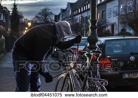 Bicycle theft, thief with bolt cutters, bicycle lock on lantern pole, Düsseldorf, North Rhine-Westphalia, Germany, Europe View Large Photo Image Stock Photography - Bicycle theft, thief with bolt cutters, bicycle lock on lantern pole, Düsseldorf, North Rhine-Westphalia, Germany, Europe. Fotosearch