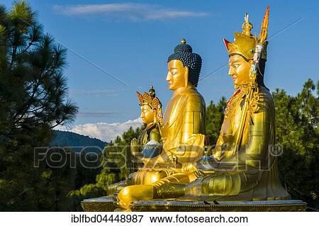 Big golden statues of Padmasambhava, Shakyamuni Buddha and Maitreya Buddha at back of Swayambhunath temple, snow covered mountains behind, Kathmandu, Nepal, Asia View Large Photo Image Stock Photo - Big golden statues of Padmasambhava, Shakyamuni Buddha and Maitreya Buddha at back of Swayambhunath temple, snow covered mountains behind, Kathmandu, Nepal, Asia. Fotosearch