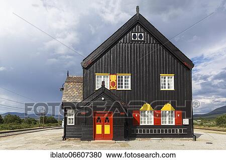 Black wooden house with red-yellow door and red-yellow shutters, historical railway station Fokstua, Dombås, Dombas, Innlandet, Dovrefjell, Norway, Europe View Large Photo Image Stock Image - Black wooden house with red-yellow door and red-yellow shutters, historical railway station Fokstua, Dombås, Dombas, Innlandet, Dovrefjell, Norway, Europe. Fotosearch