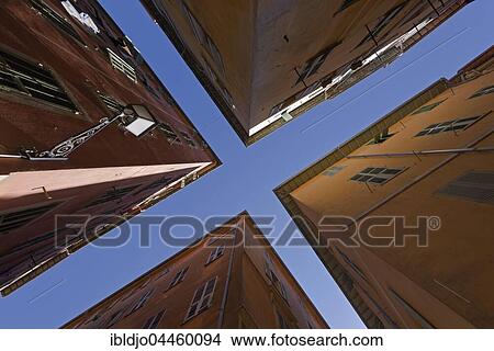 Blue sky between houses in narrow streets, Nice, Provence-Alpes-Côte d'Azur, France, Europe View Large Photo Image Picture - Blue sky between houses in narrow streets, Nice, Provence-Alpes-Côte d'Azur, France, Europe. Fotosearch