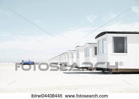 Blue VW Beetle cabriolet faces white beach huts, beach of Loekken, Løkken, Denmark, Europe View Large Photo Image Stock Photography - Blue VW Beetle cabriolet faces white beach huts, beach of Loekken, Løkken, Denmark, Europe. Fotosearch