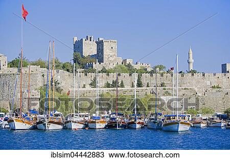 Stock Image - Boats in front of Bodrum Castle or St. Peter's Castle, Bodrum Kalesi, Bodrum, Turkey, Asia. Fotosearch