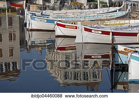 Stock Photo - Boats in the harbour with reflections of buildings, La Ciotat, Provence-Alpes-Côte d'Azur, France, Europe. Fotosearch