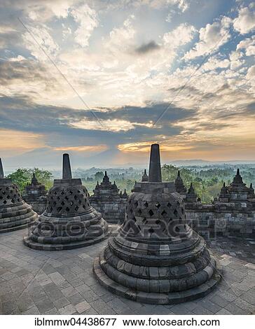 Borobudur Temple at sunrise, stupas, cloudy sky, Borobudur, Yogyakarta, Java, Indonesia, Asia View Large Photo Image Stock Photo - Borobudur Temple at sunrise, stupas, cloudy sky, Borobudur, Yogyakarta, Java, Indonesia, Asia. Fotosearch
