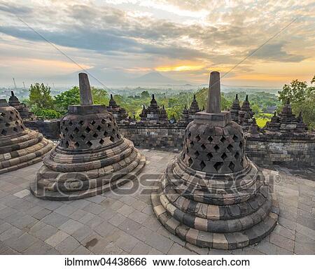 Stock Photograph - Borobudur Temple at sunrise, stupas, cloudy sky, Borobudur, Yogyakarta, Java, Indonesia, Asia. Fotosearch