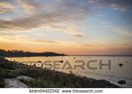 Boulders in water, evening light at Baltic Sea coast, Gulf of Finland, Eisma, Estonia, Europe View Large Photo Image Stock Image - Boulders in water, evening light at Baltic Sea coast, Gulf of Finland, Eisma, Estonia, Europe. Fotosearch