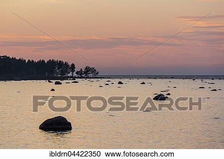 Boulders in water, evening light at Baltic Sea coast, Gulf of Finland, Eisma, Estonia, Europe View Large Photo Image Stock Image - Boulders in water, evening light at Baltic Sea coast, Gulf of Finland, Eisma, Estonia, Europe. Fotosearch