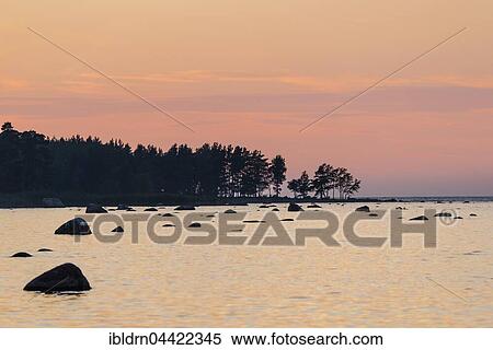 Boulders in water, evening light at Baltic Sea coast, Gulf of Finland, Eisma, Estonia, Europe View Large Photo Image Stock Photography - Boulders in water, evening light at Baltic Sea coast, Gulf of Finland, Eisma, Estonia, Europe. Fotosearch