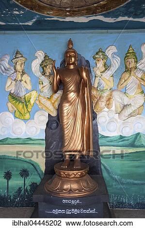 Bronze Buddha statue, Standing Buddha, mural, Weherahena Temple, Matara, Southern Province, Sri Lanka, Asia View Large Photo Image Stock Image - Bronze Buddha statue, Standing Buddha, mural, Weherahena Temple, Matara, Southern Province, Sri Lanka, Asia. Fotosearch