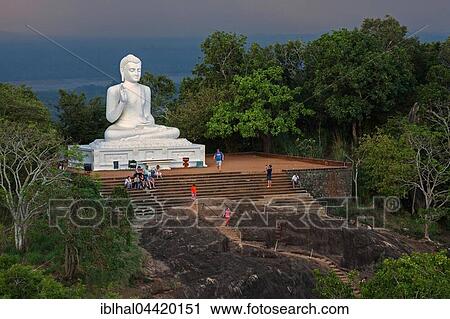 Stock Image - Buddha statue, Seated Buddha, stormy atmosphere, Mihintale, North Central Province, Sri Lanka, Asia. Fotosearch