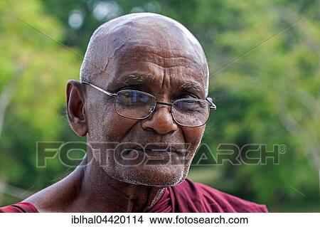 Buddhist monk, portrait, Anuradhapura, North Central Province, Sri Lanka, Asia View Large Photo Image Picture - Buddhist monk, portrait, Anuradhapura, North Central Province, Sri Lanka, Asia. Fotosearch
