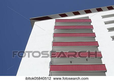 Stock Image - Building facade with red balconies on a residential building, Bremerhaven, Bremen, Germany, Europe. Fotosearch