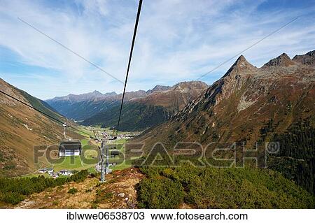 Stock Image - Cable car Birkhahnbahn with Gorfenspitze and view of Galtür, Paznauntal, Silvretta, Tyrol, Austria, Europe. Fotosearch