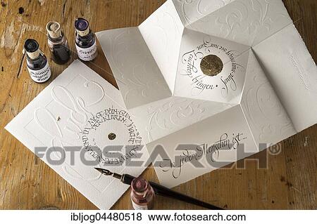 Calligraphy studio, cards with writing, hand imprints, inkwells at back, penholder with drawing pen at front, Seebruck, Upper Bavaria, Germany, Europe View Large Photo Image Stock Photo - Calligraphy studio, cards with writing, hand imprints, inkwells at back, penholder with drawing pen at front, Seebruck, Upper Bavaria, Germany, Europe. Fotosearch