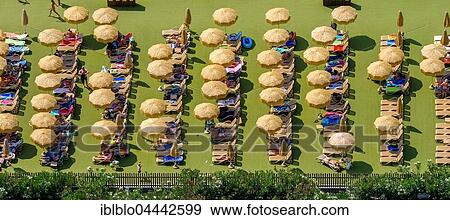 Camping guests on sun terrace with parasols, Piani di Clodia Camping, Lazise, Lake Garda, Veneto, Italy, Europe View Large Photo Image Stock Photo - Camping guests on sun terrace with parasols, Piani di Clodia Camping, Lazise, Lake Garda, Veneto, Italy, Europe. Fotosearch