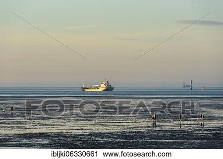 Cargo ship on world shipping route Elbe at the Wadden Sea, Cuxhaven, Lower Saxony, Germany, Europe View Large Photo Image Stock Image - Cargo ship on world shipping route Elbe at the Wadden Sea, Cuxhaven, Lower Saxony, Germany, Europe. Fotosearch