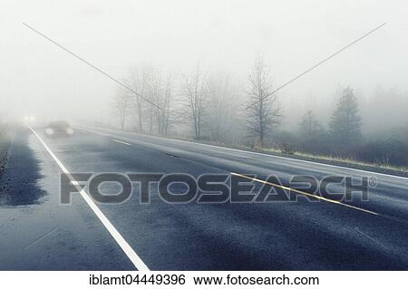 Cars approaching with headlights, dense fog on road, Germany, Europe View Large Photo Image Stock Photograph - Cars approaching with headlights, dense fog on road, Germany, Europe. Fotosearch