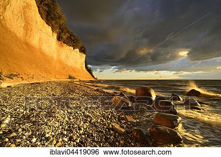 Chalk cliffs in early morning light, dark clouds, boulders, Jasmund National Park, Rügen, Mecklenburg-Western Pomerania, Germany, Europe View Large Photo Image Stock Photograph - Chalk cliffs in early morning light, dark clouds, boulders, Jasmund National Park, Rügen, Mecklenburg-Western Pomerania, Germany, Europe. Fotosearch