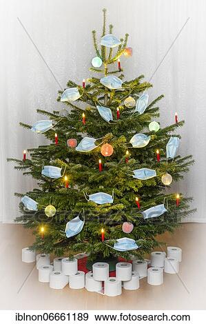 Christmas tree decorated with face masks. Under the Christmas tree are toilet paper rolls as presents. Theme image for Christmas 2020 during the corona pandemic, symbol image, 25. 11. 2020., Offenbach am Main, Hesse, Germany, Europe View Large Photo Image Stock Photo - Christmas tree decorated with face masks. Under the Christmas tree are toilet paper rolls as presents. Theme image for Christmas 2020 during the corona pandemic, symbol image, 25. 11. 2020., Offenbach am Main, Hesse, Germany, Europe. Fotosearch