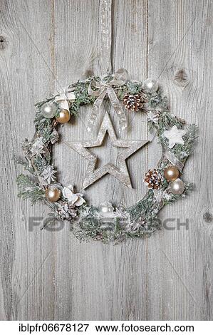 Christmas wreath on wooden wall with star View Large Photo Image Stock Photo - Christmas wreath on wooden wall with star. Fotosearch