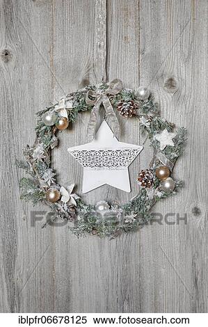Christmas wreath on wooden wall with star View Large Photo Image Stock Photography - Christmas wreath on wooden wall with star. Fotosearch