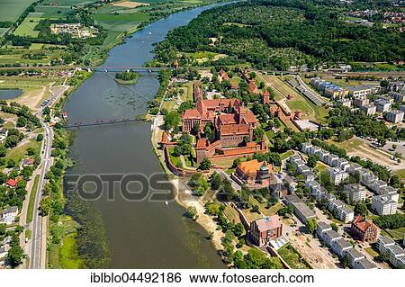 Stock Photograph - Cityscape with Ordensburg, Nogat River, Malbork, Pomerania Province, Poland, Europe. Fotosearch