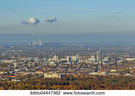 Cityscape with skyscrapers, power company Innogy with smoking chimneys behind, Essen, Ruhr district, North Rhine-Westphalia, Germany, Europe View Large Photo Image Stock Image - Cityscape with skyscrapers, power company Innogy with smoking chimneys behind, Essen, Ruhr district, North Rhine-Westphalia, Germany, Europe. Fotosearch
