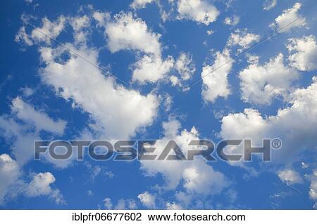 Stock Image - Clouds in a blue sky. Fotosearch