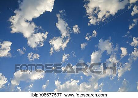 Clouds in a blue sky View Large Photo Image Stock Photo - Clouds in a blue sky. Fotosearch