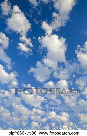 Stock Photo - Clouds in a blue sky. Fotosearch