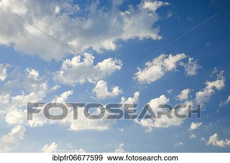 Clouds in a blue sky View Large Photo Image Stock Photo - Clouds in a blue sky. Fotosearch