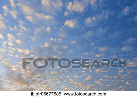 Clouds in a blue sky View Large Photo Image Stock Photography - Clouds in a blue sky. Fotosearch