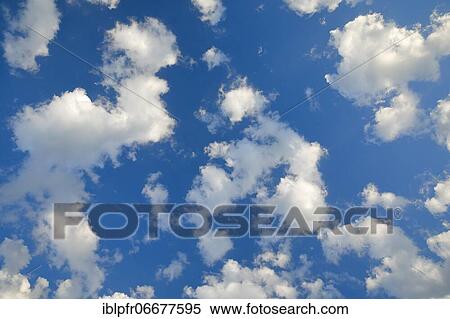 Clouds in a blue sky View Large Photo Image Stock Photography - Clouds in a blue sky. Fotosearch