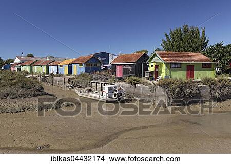 Colorful huts of oyster farmers on a channel at low tide, Le Château-d' Oléron, Oléron, Ile d' Oleron, Charente-Maritime, France, Europe View Large Photo Image Picture - Colorful huts of oyster farmers on a channel at low tide, Le Château-d' Oléron, Oléron, Ile d' Oleron, Charente-Maritime, France, Europe. Fotosearch