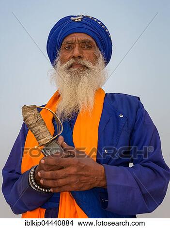 Colorful Sikh guard with saber, Golden Temple, Amritsar, Punjab, North India, India, Asia View Large Photo Image Picture - Colorful Sikh guard with saber, Golden Temple, Amritsar, Punjab, North India, India, Asia. Fotosearch