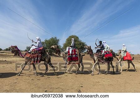 Colourful camel riders at a Tribal festival, Sahel, Chad, Africa View Large Photo Image Stock Photo - Colourful camel riders at a Tribal festival, Sahel, Chad, Africa. Fotosearch