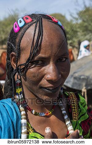 Stock Photo - Colourful dressed woman, portrait, Sahel, Chad, Africa. Fotosearch