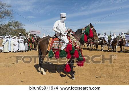 Colourful horse rider at a Tribal festival, Sahel, Chad, Africa View Large Photo Image Picture - Colourful horse rider at a Tribal festival, Sahel, Chad, Africa. Fotosearch