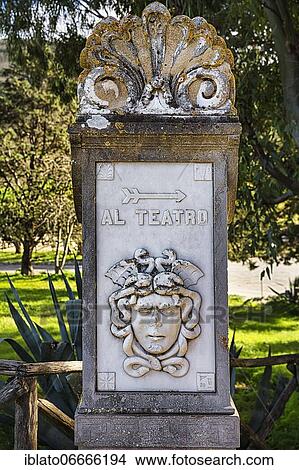 Column with a face and the inscription Al Teatro, signpost to the theatre, Segesta temple complex, Trapani province, Sicily, Italy, Europe View Large Photo Image Picture - Column with a face and the inscription Al Teatro, signpost to the theatre, Segesta temple complex, Trapani province, Sicily, Italy, Europe. Fotosearch
