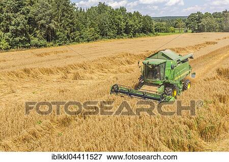 Combine harvester in the corn field, Allgäu, Bavaria, Germany, Europe View Large Photo Image Stock Photo - Combine harvester in the corn field, Allgäu, Bavaria, Germany, Europe. Fotosearch
