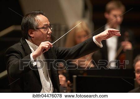 Conductor Shao-Chia Lü conducting at concert, Rhein-Mosel-Halle, Koblenz, Rhineland-Palatinate, Germany, Europe View Large Photo Image Stock Photo - Conductor Shao-Chia Lü conducting at concert, Rhein-Mosel-Halle, Koblenz, Rhineland-Palatinate, Germany, Europe. Fotosearch