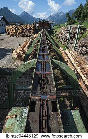 Conveyor belt of a sawmill, Hinterthiersee Kufstein District, Tyrol, Austria, Europe View Large Photo Image Stock Photo - Conveyor belt of a sawmill, Hinterthiersee Kufstein District, Tyrol, Austria, Europe. Fotosearch