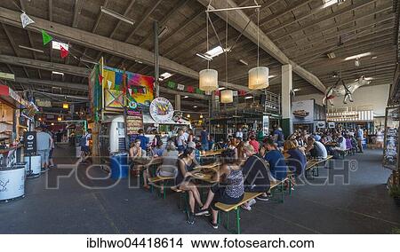 Picture - Copenhagen Street Food, hall with international food stalls, Holmen, Copenhagen, Denmark, Europe. Fotosearch
