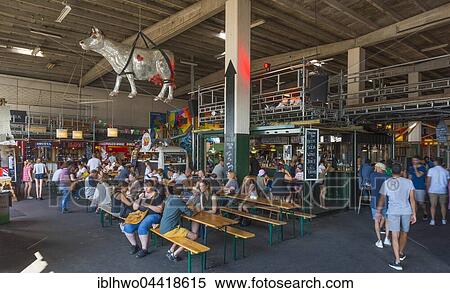 Stock Photography - Copenhagen Street Food, hall with international food stalls, Holmen, Copenhagen, Denmark, Europe. Fotosearch