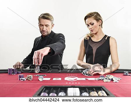 Couple playing blackjack, playing cards, chips, casino View Large Photo Image Picture - Couple playing blackjack, playing cards, chips, casino. Fotosearch